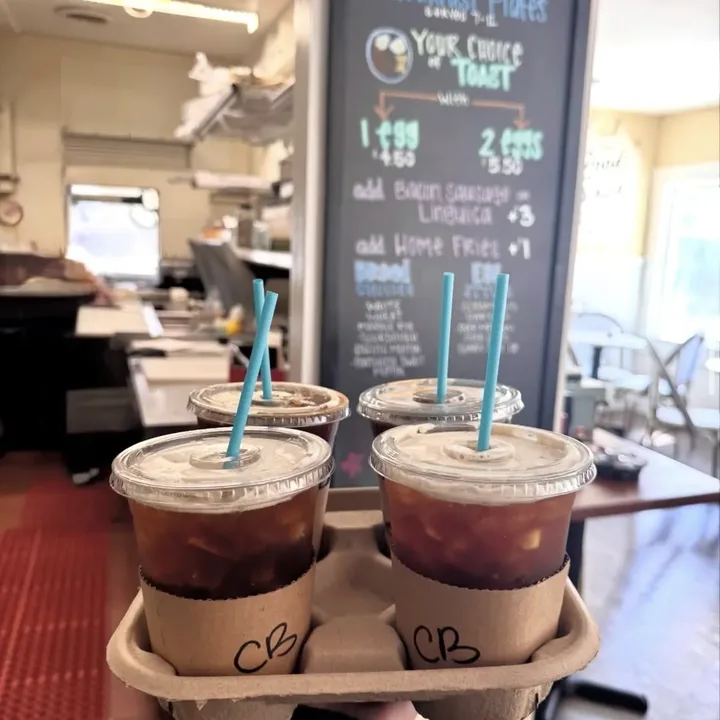 Four iced coffees in a carry tray