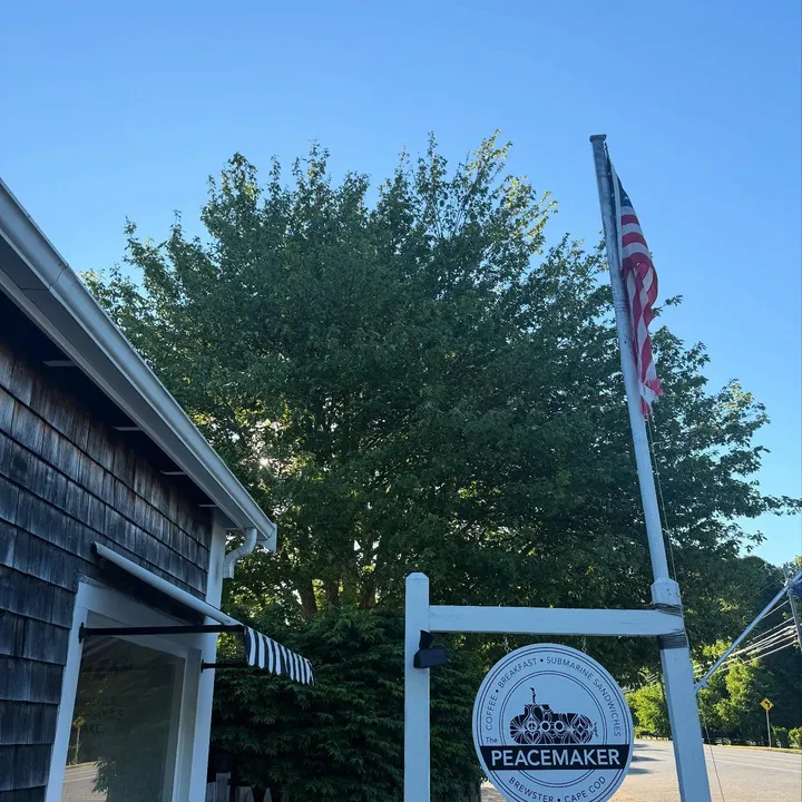 The Peacemaker roadside sign against a blue summer sky