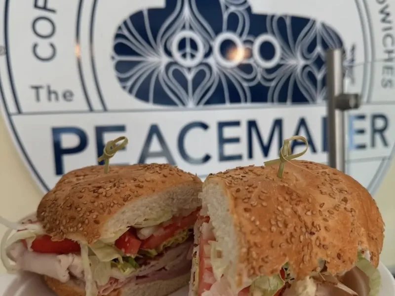 A turkey sub on a seeded roll, cut in half